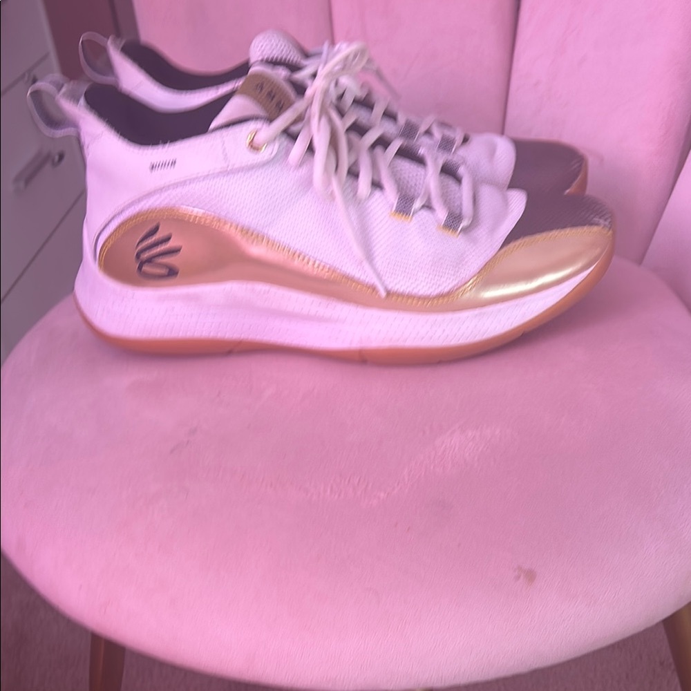 Under Armour White and Gold Sneakers with Streamlined Design